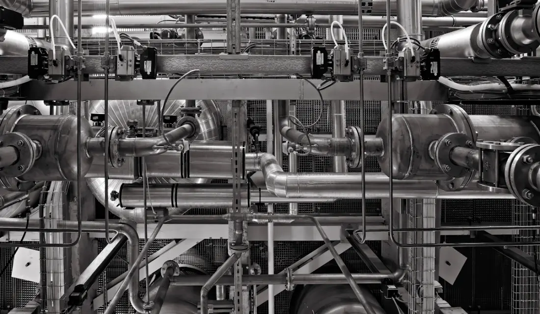Interconnected metal pipes and valves in an industrial facility